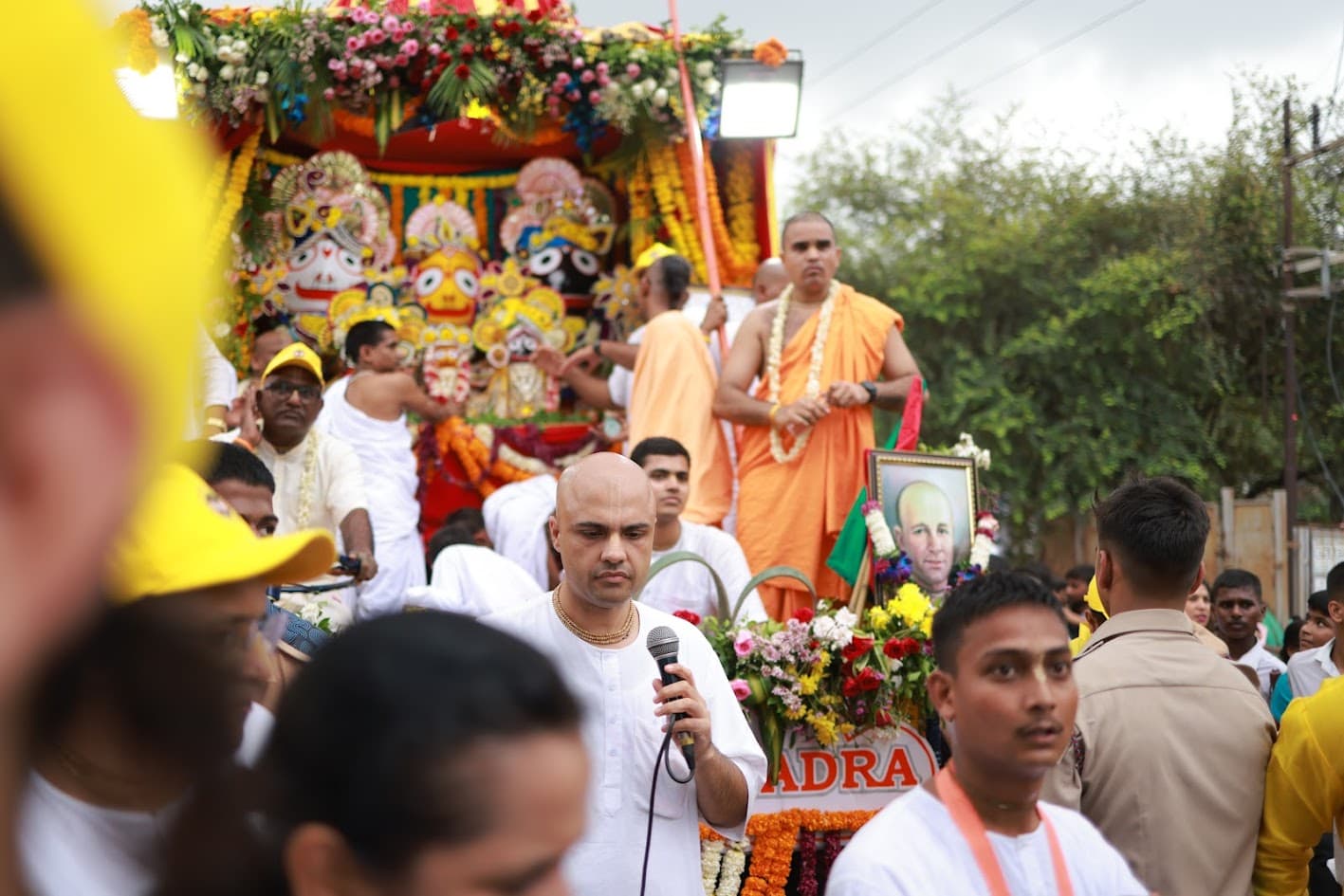 Devotees pulling the Ratha Yatra chariot through the streets of Attapur, with Their Lordships Jagannath, Baladeva and Subhadra on the chariot